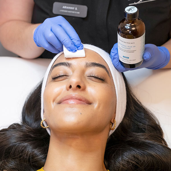 woman getting face treatment