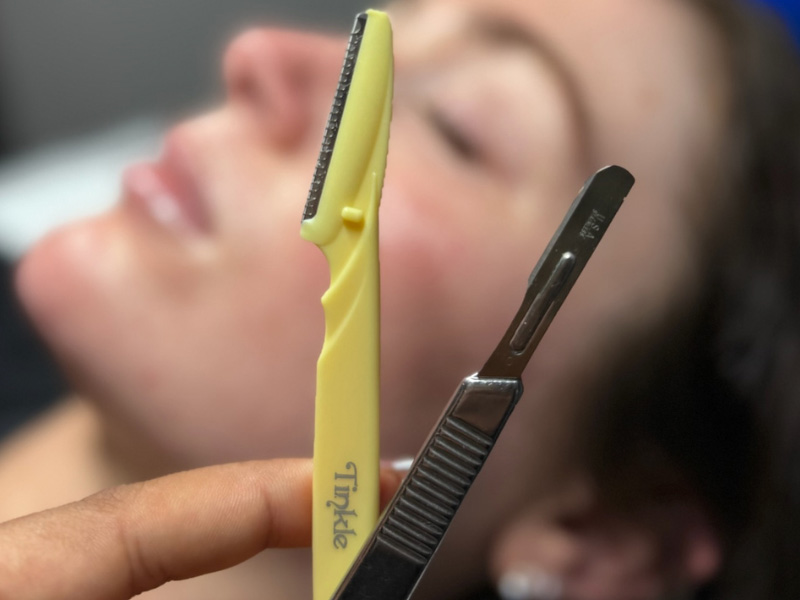 Close-up of facial hair removal tool.
